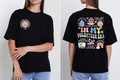 Black t-shirt featuring a colorful retro-inspired "In My Volunteer Era" design with volunteer, school spirit, fundraising, teacher appreciation, and student support graphics on the back and a coordinating logo on the left chest.