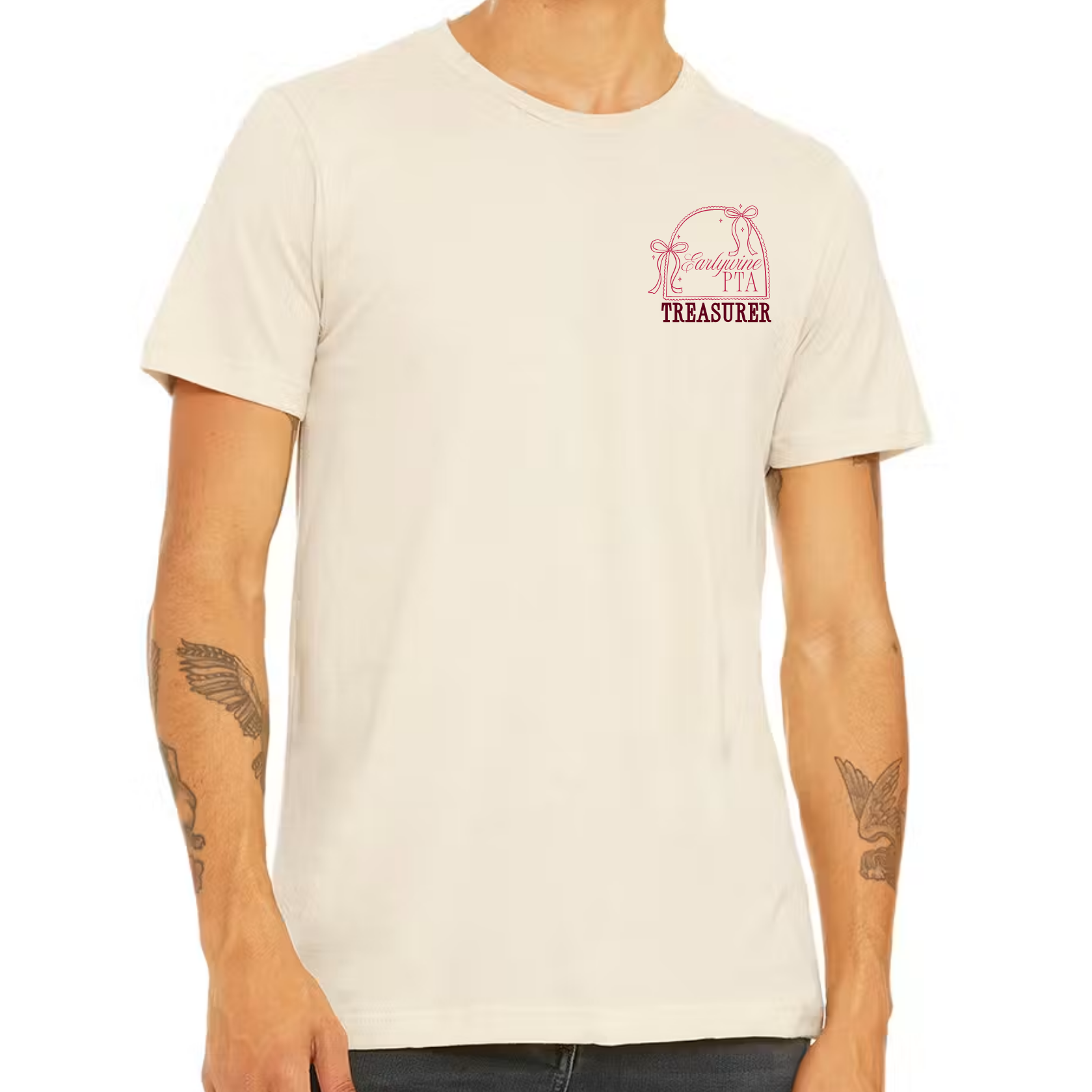 Adult wearing a cream-colored t-shirt featuring the Community Bow design customized with a Treasurer title and organization branding on the left chest.